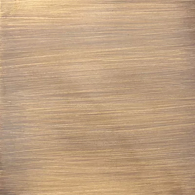 A close-up of a brushed, aged brass surface with a subtle sheen, showcasing Koket's Aged Brass (Gloss) finish.