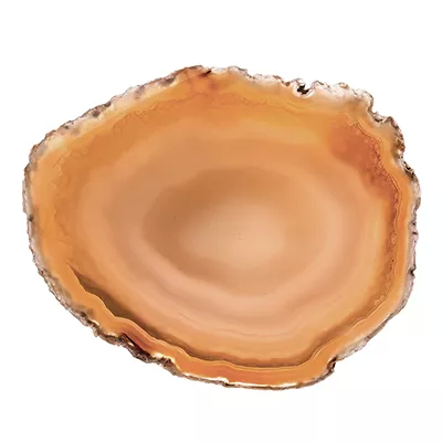 A close-up of a warm, amber-toned agate slice with natural banding and crystalline details, showcasing Koket's Amber Agate finish.
