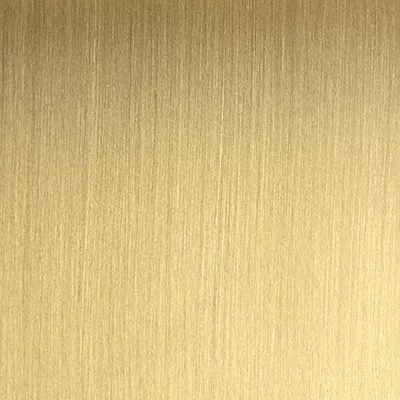 Close-up Brushed Brass: golden metallic surface with a linear brushed texture, featuring a soft and satin sheen.