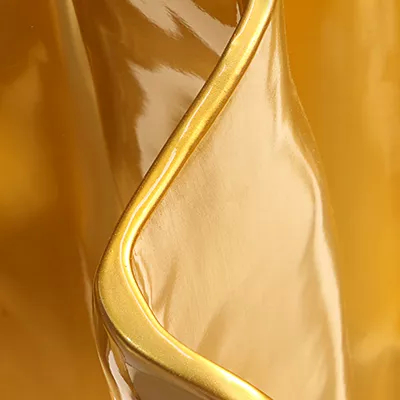 A close-up on the finish, showcasing its polished gold chromium finish with a glossy sheen.