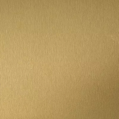 Close-up Satin Brass: golden metallic surface with a fine and uniform texture, featuring a soft and satin sheen.