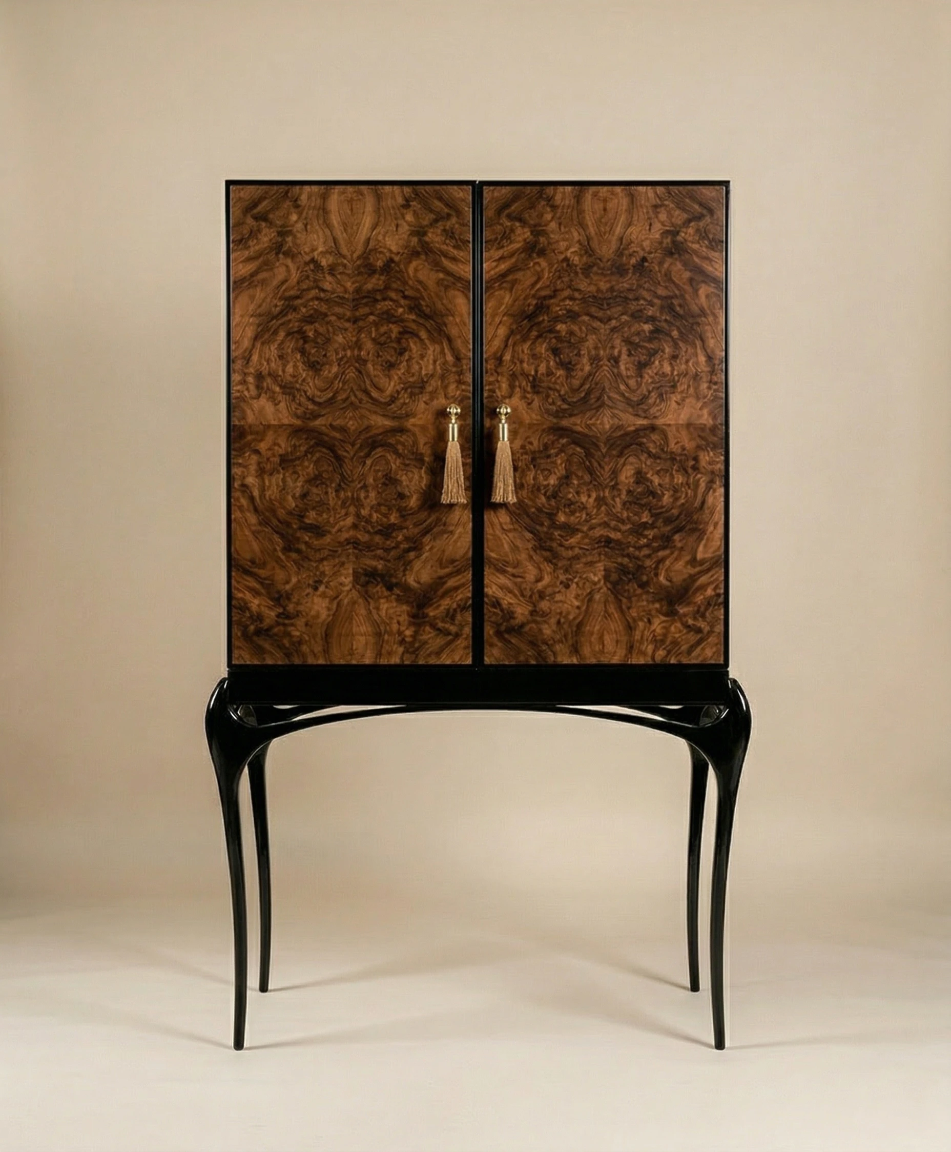 Luxury Temptation cabinet with rich wood veneer doors, black sculptural legs and gold tassel handles