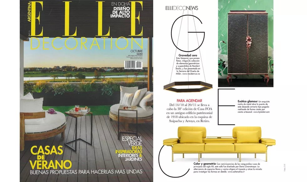 Page from Elle Decoration featuring the Divine Armoire, a dark, patterned cabinet with ornate gold handles, and design news.