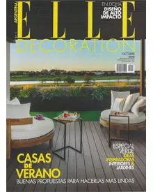 Elle Decoration Argentina cover showcasing an outdoor living space with round chairs and a view of a golf course.