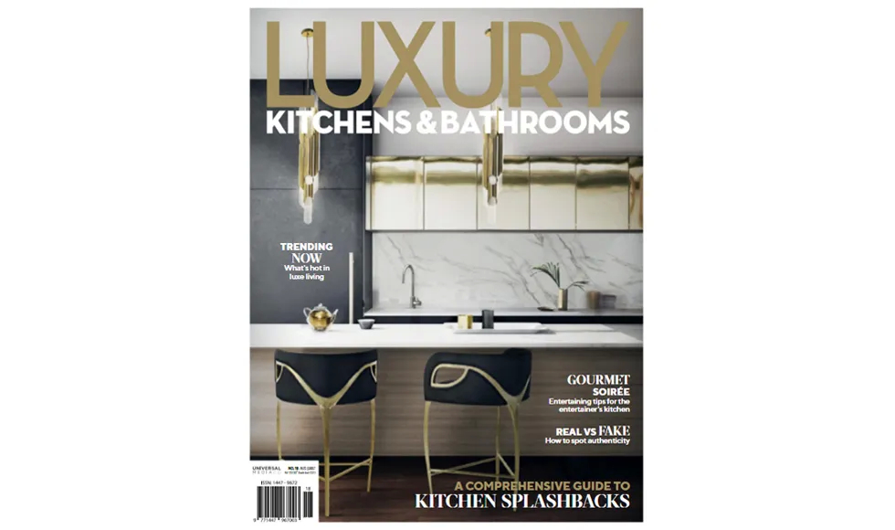 Press clipping of the Luxury Kitchens & Bathrooms magazine cover featuring a modern kitchen with bar stools.