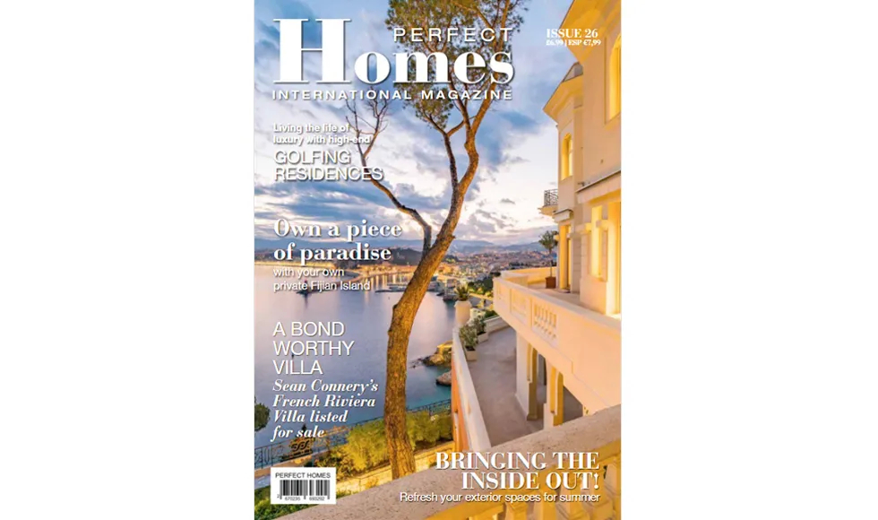 Press clipping of Perfect Homes magazine cover featuring a luxurious villa overlooking the sea.