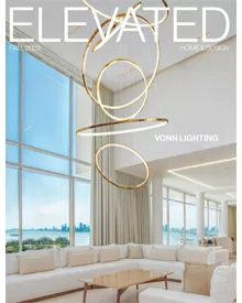 Press clipping of Elevated Luxury magazine cover, featuring a modern living room with a large chandelier and ocean view.