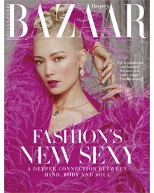 Press clipping of Harper's Bazaar Singapore cover featuring Pom Klementieff in fuchsia feathers.