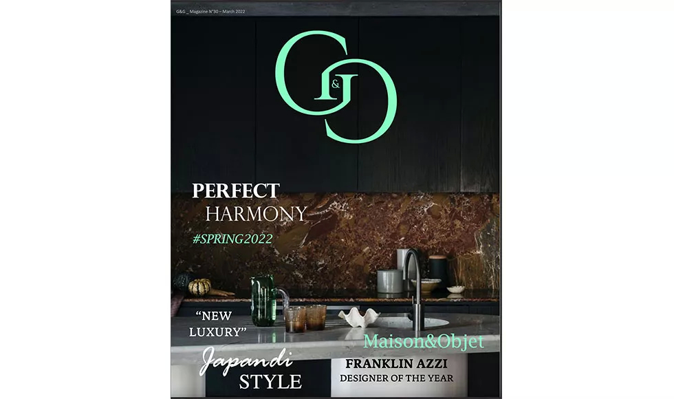 G&G magazine cover: A luxurious kitchen with dark cabinetry, marble backsplash, and modern decor. Perfect Harmony.