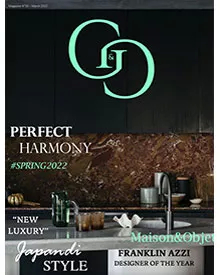G&G magazine cover: A luxurious kitchen with dark cabinetry, marble backsplash, and modern decor. Perfect Harmony.