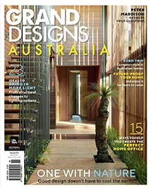 Grand Designs Australia press clipping cover featuring a modern home with wooden walls and a plant.