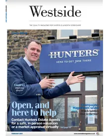 Westside press clipping cover featuring a man in a suit gesturing towards a "Hunters" building.