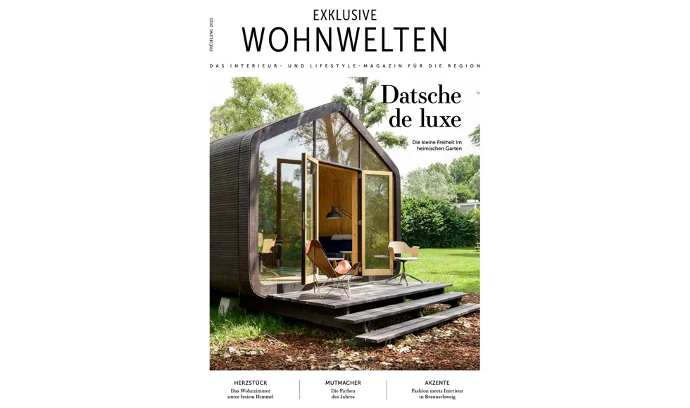 Exklusive Wohnwelten press clipping cover, featuring a modern, small wooden house with large glass doors.