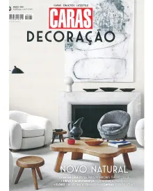 Caras Decoração press clipping, the cover featuring a modern living room with neutral tones and wooden furniture.