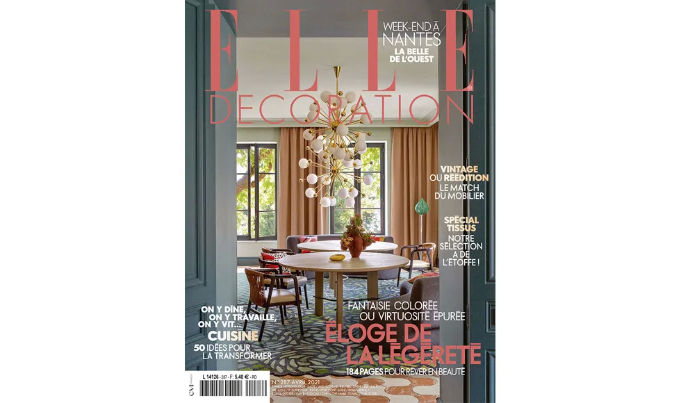 Press clipping: Elle Decoration magazine cover featuring a dining room with a large, modern chandelier.