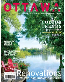 Ottawa At Home magazine cover featuring a serene lake view with red Adirondack chairs, highlighting color trends and renovations.