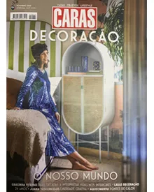 Caras Decoração magazine cover showing a woman in a blue dress next to a stylish cabinet in a vibrant interior.