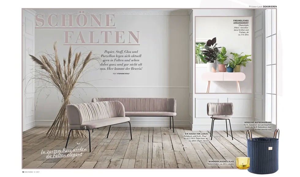 Wohnidee magazine spread featuring elegant pleated furniture in a soft pink hue and a separate section on home decor items.