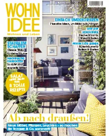 Wohnidee magazine cover with a cozy living room featuring a floral sofa, coffee table, and various decor items.