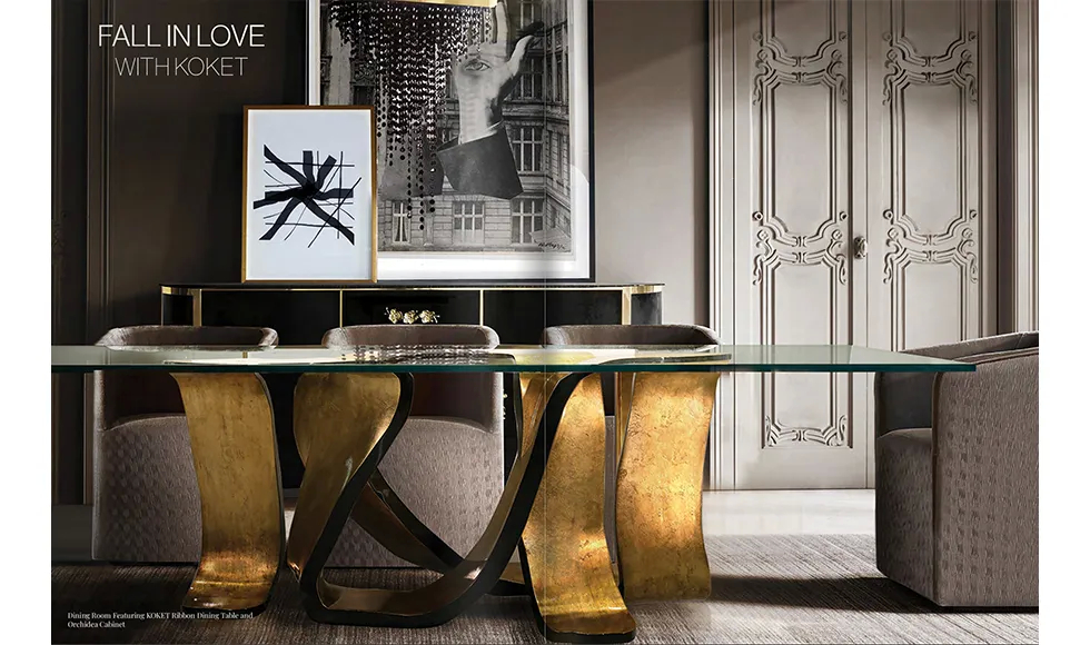 Elevated press clipping: a luxurious dining room featuring Koket's Ribbon Dining Table with a clear top and ornate golden base.