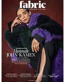 Fabric magazine cover featuring Hannah John-Kamen in a vibrant purple and green faux fur coat, with interview details.