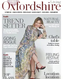 Oxfordshire Living magazine cover with a smiling woman in a flowing dress, highlighting trendsetter features and holiday content.