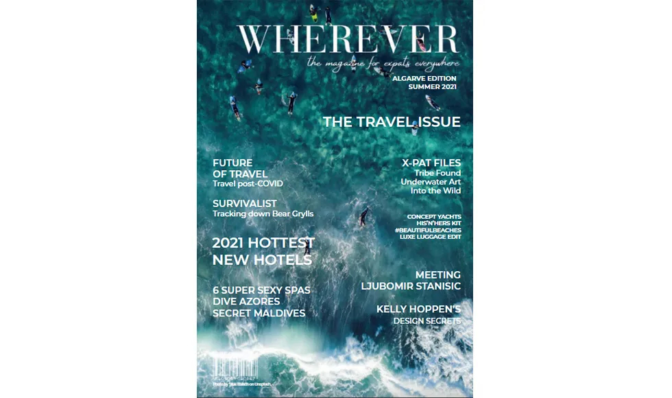 Wherever press clipping, the cover, featuring an aerial view of people surfing in blue ocean water.