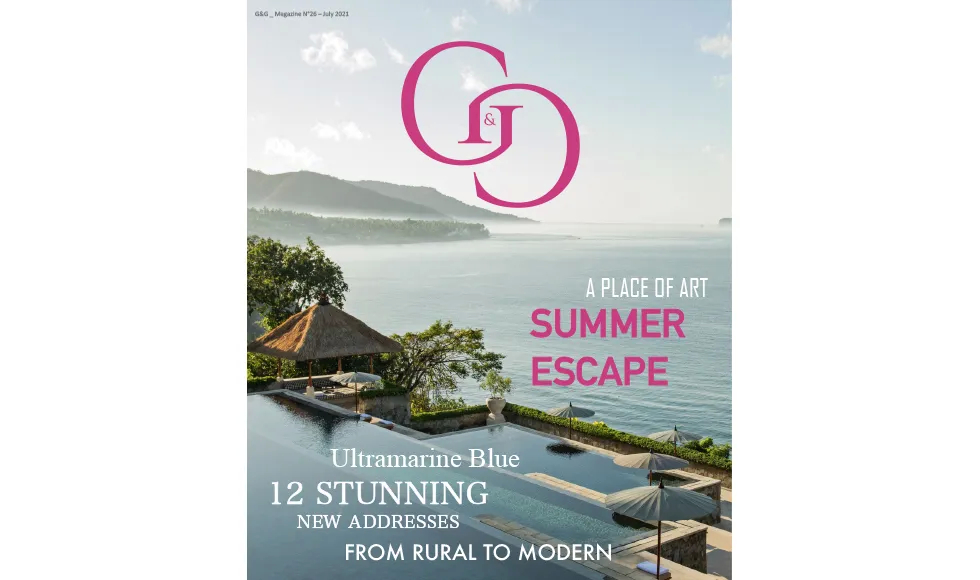 G&G press clipping, the cover, featuring a luxury resort with an infinity pool overlooking the ocean.