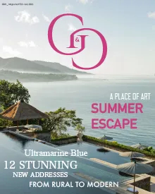 G&G press clipping, the cover, featuring a luxury resort with an infinity pool overlooking the ocean.