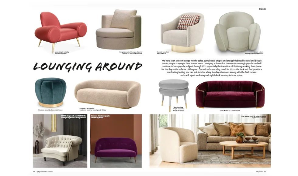 Australia Giftguide press clipping featuring a plush sofa and a black cabinet next to a dining table.