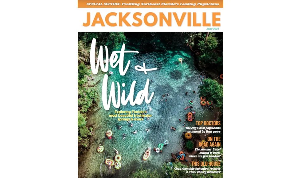 Jacksonville Magazine cover with an aerial view of people swimming in a clear, blue-green river.