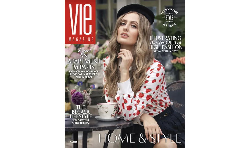 Vie Magazine cover featuring a woman in a strawberry-print shirt and beret, sitting at an outdoor table.