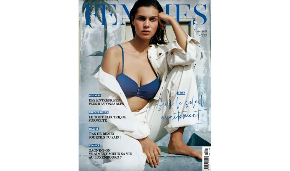 Femmes magazine cover featuring a woman in a blue bikini top and white jacket.