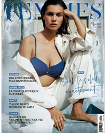 Femmes magazine cover featuring a woman in a blue bikini top and white jacket.