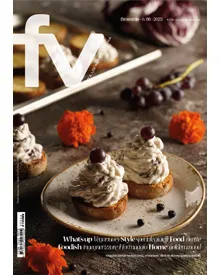Cover of FunnyVegan Magazine, December 2023, featuring small appetizers and red grapes.