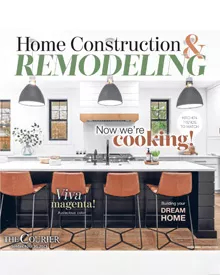 Waterloo Courier Home Construction & Remodeling cover, featuring a modern kitchen with a large island and bar stools.