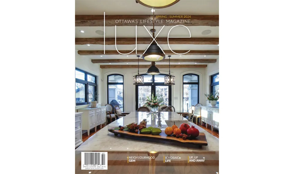 Cover of LUXE Magazine Ottawa, April 2024, showcasing a luxurious kitchen with exposed wooden beams and stylish lighting.