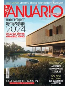 Cover of VIP Anuário Portugal magazine, featuring a modern house by a lake and headlines about luxury decor in 2024.
