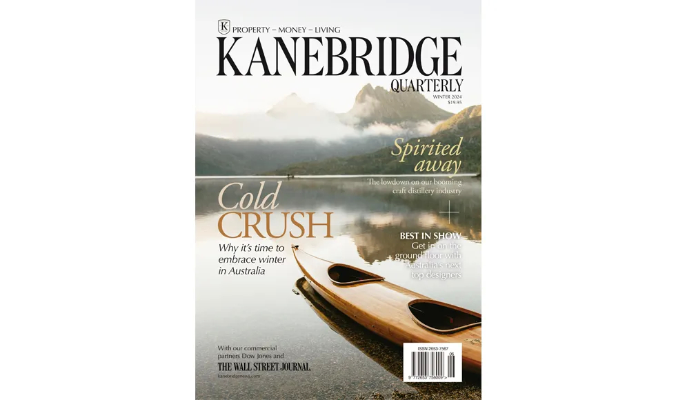 Kanebridge News Quarterly cover, featuring a canoe on a lake with mountains in the background. The text "Cold Crush" is prominent.