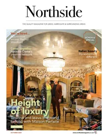 Press clipping of Northside magazine cover, October 2024, featuring a couple in a luxurious living room.