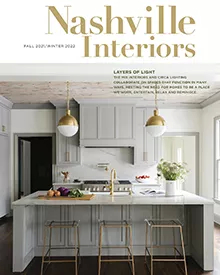 Press clipping of Nashville Interiors magazine cover, featuring a modern kitchen with island and pendant lights.