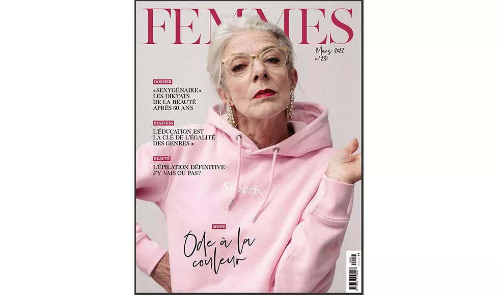 Magazine cover of Femmes featuring an older woman with glasses and a pink hoodie, with French text headlines.