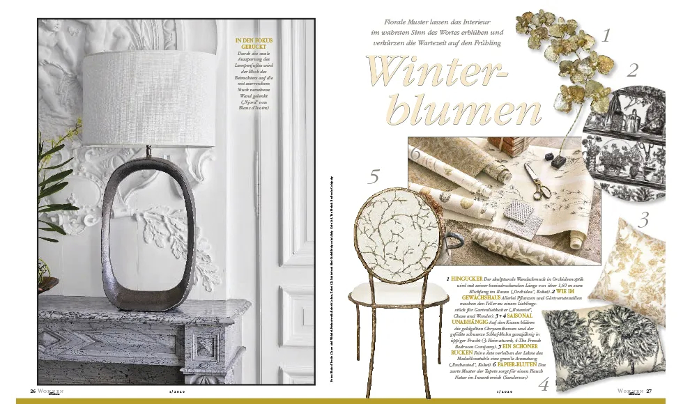 Magazine spread from Wohnen & Garten, featuring a table lamp, wallpaper, pillows, and an Enchanted Chair.