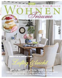 Magazine cover of Wohnen & Träume, featuring a dining room with elegant furniture and flowers.