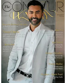 The cover of The Contour of Luxury magazine features a smiling man in a light suit against a dark background.
