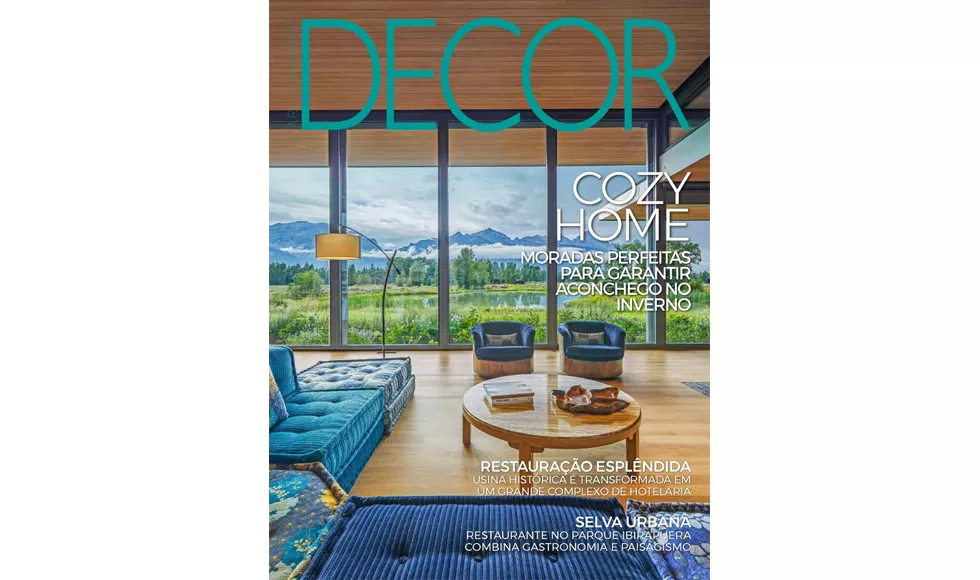 Cover of Decor magazine with a modern living room featuring large windows overlooking a lake and mountains.