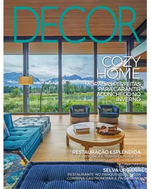 Cover of Decor magazine with a modern living room featuring large windows overlooking a lake and mountains.