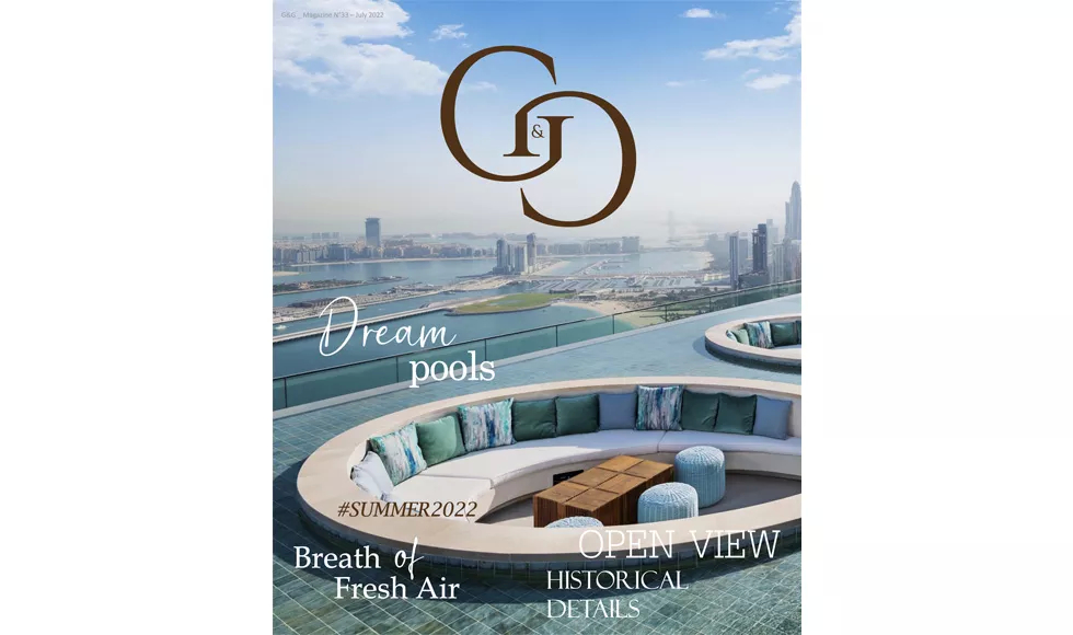 Cover of G&G magazine featuring an infinity pool with city views at Address Beach Resort, Dubai.