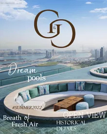 Cover of G&G magazine featuring an infinity pool with city views at Address Beach Resort, Dubai.