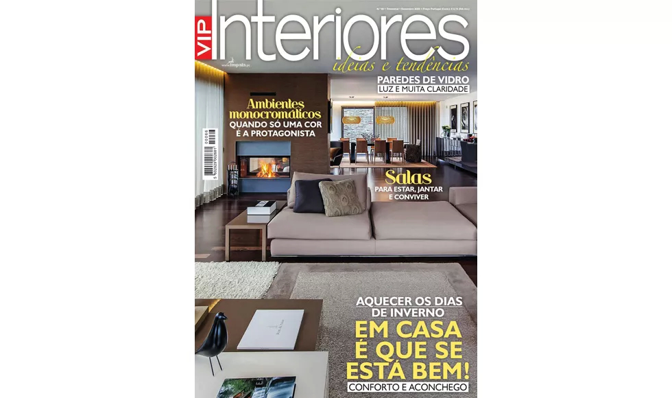 Press clipping: The cover of VIP Interiores magazine, featuring a modern living room with a fireplace.